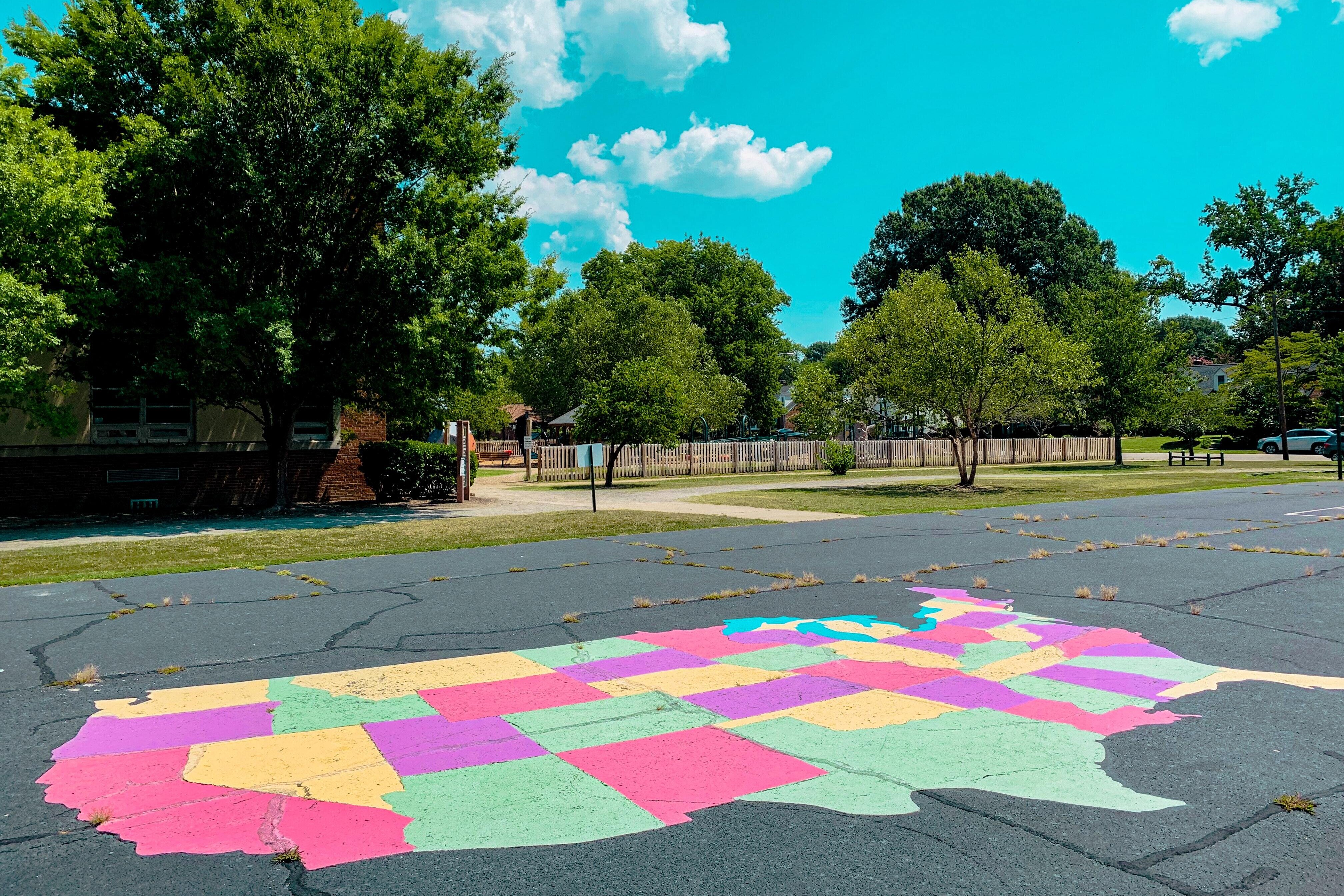 Chalk Drawing of the United States in a Parking Lot Near a Park