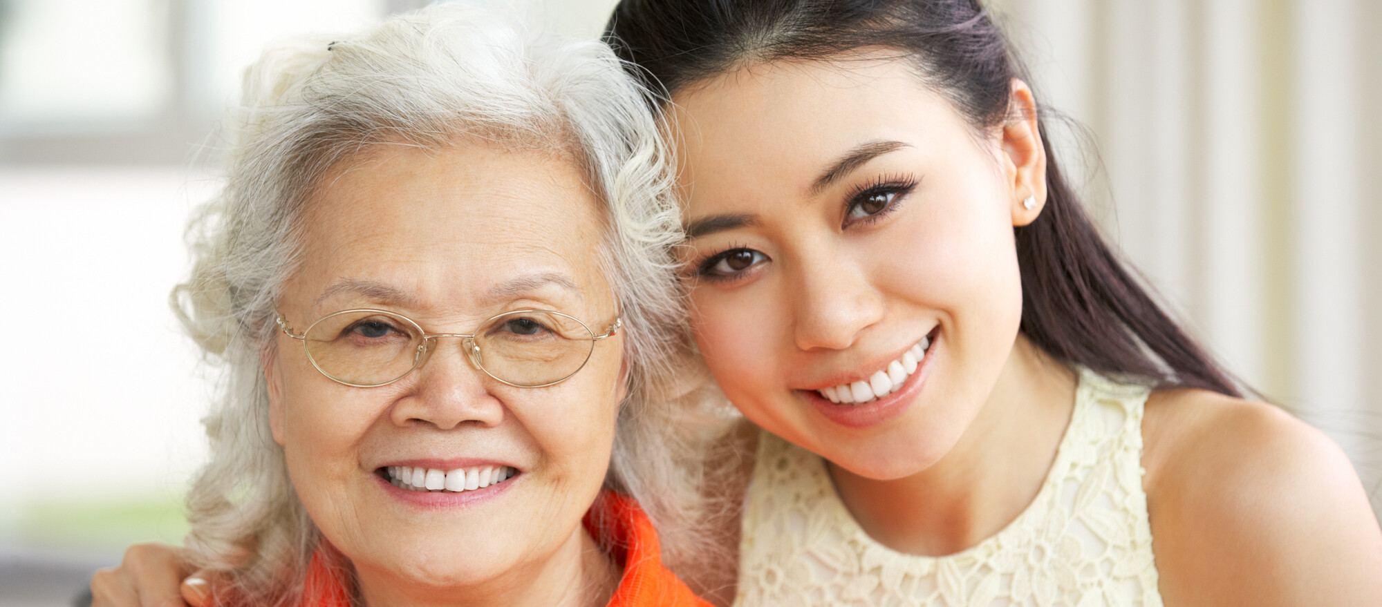 Old Woman and Young Woman Smiling in a Headshot